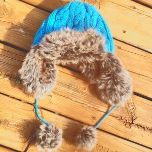 Knit faux fur hat with tassels